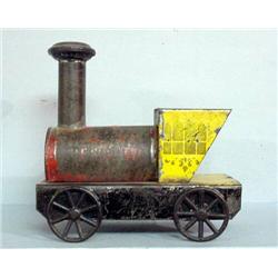 TIN TRAIN ENGINE. Made by George Brown with original, worn yellow, red, black, and blue paint. St…