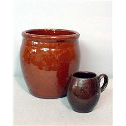 TWO PIECES OF REDWARE. Small crock with wide, incised line below rim. Some glaze wear on rim. 5"d…