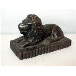 SEWERTILE LION. Reclining on a scalloped edge base with dark brown paint. Incised "LE", "2-7-42".…