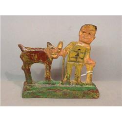 WOODEN CARVING BY ELIJAH PIERCE. Man with two canes walking with a goat. Brown, yellow, green, an…