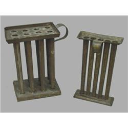 TWO TIN CANDLE MOLDS. Folded rims and applied handles. Twelve-tube (minor damage and traces of gr…