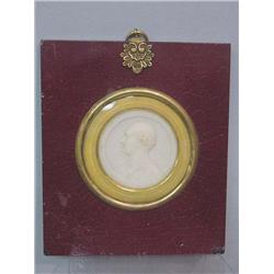 WAX PORTRAIT MEDALLION. Profile of a man with thinning hair and classical robe, done in white wax…