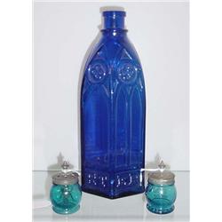 THREE PIECES OF BLUE GLASS. Two Christmas salts. Peacock blue with tin lids (one has an agitator)…
