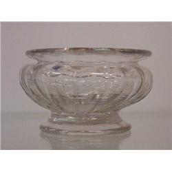 CLEAR BLOWN GLASS SALT. Fluted with a flared rim and applied round foot. 3"d. 1 3/4"h.…