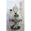 Image 1 : TWO GLASS PIECES: Four-bottle, mold blown caster set in a pewter holder. Two cruets, shaker, and …