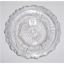 FOUR CLEAR LACY GLASS PIECES. Pictured is an oak leaf pattern tray, 6 1/2"l. and a peacock eye to…