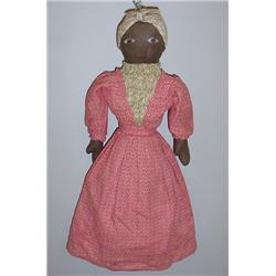 TOPSY-TURVEY DOLL. Stuffed cloth with a black mammy on one side and a white woman with a bonnet o…