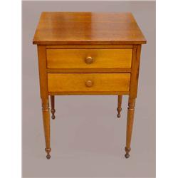 SHERATON TWO-DRAWER STAND. Refinished cherry with poplar secondary wood. Tapered ball feet with a…