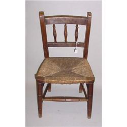 ENGLISH COUNTRY CHILD'S CHAIR. Walnut with an old brown finish. Bamboo turned legs and front stre…