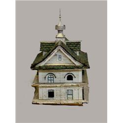 EARLY BIRD HOUSE. Worn white paint with green shingles. Shaped like a horse barn with two levels …