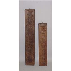 TWO CARVED COOKIE BOARDS. One is walnut with dark old finish and figures of a queen and a gentlem…