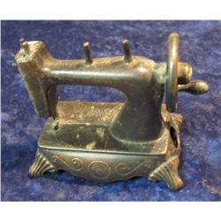 1394. "Play Me" Antique Sewing Machine Pencil Sharpener. Metal.