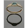 Image 1 : Beautiful custom made bright green Brazilian oval  shaped garnet surrounded by 3 CT to 5 CT of  diam