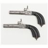 Image 2 : Pair of Ebony stocked percussion muff pistols, .54  cal., 3” round barrels, engraved frames, folding