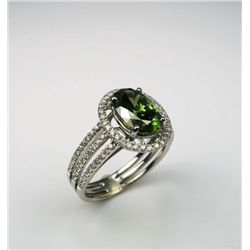 Gorgeous 2.52 carat Oval cut Fancy Green Diamond  and White Diamond Ring set in a lovely halo style 
