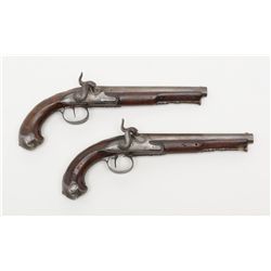 Pair of classic French silver mounted pistols  converted from flintlock to percussion with ornate  E