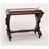 Image 1 : Turn-of-the-century carved patriotic wood and  glass table with wooden rollers, approx. 28” long  x 