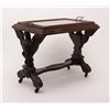 Image 2 : Turn-of-the-century carved patriotic wood and  glass table with wooden rollers, approx. 28” long  x 
