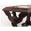 Image 3 : Turn-of-the-century carved patriotic wood and  glass table with wooden rollers, approx. 28” long  x 