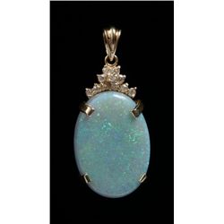 30 CT. plus black opal doublet in 14K gold  mounting with accenting diamonds. The opal shows  pinpoi