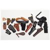 Image 1 : Lot of 11 misc. leather and fabric holsters, a  number are Police duty style from the 1970’s-80’s;  