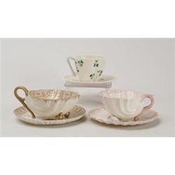 THREE BELLEEK TEACUPS.  