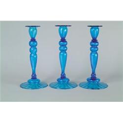 LOT OF THREE STEUBEN CANDLESTICKS.  