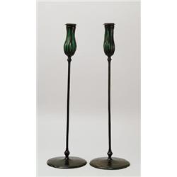 TWO TIFFANY BRONZE & RETICULATED GLASS CANDLESTICKS. 