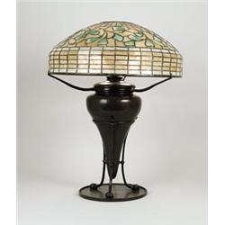 SIGNED TIFFANY WHIRLING LEAF TABLE LAMP.  