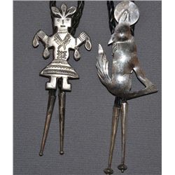 TWO NAVAJO SILVER BOLOS