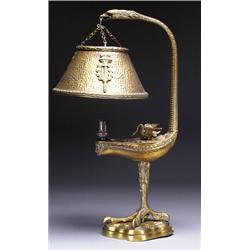 CONTINENTAL GILT-BRONZE DESK LAMP, probably French, the shade pendant from a bird's beak above a...