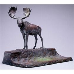 AUSTRIAN PATINATED BRONZE MOOSE INKSTAND, the animal standing on a rectangular landscaped base fl...