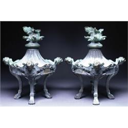 PAIR OF CONTINENTAL BRONZE GARDEN URNS, fluted below flambeau finials and raised on four slender...