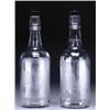 Image 1 : PAIR OF HAWKES BOTTLE-SHAPED ENGRAVED GLASS DECANTERS, with plain stoppers, each decorated with a...