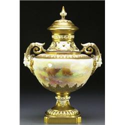 ROYAL WORCESTER TWO-HANDLED VASE AND COVER, with moulded and gilt decorated cover, mask and scrol...