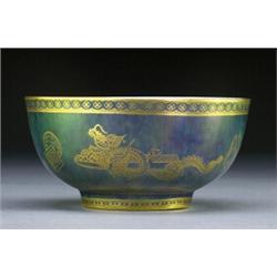 WEDGWOOD 'DRAGON LUSTRE' BOWL, of circular shape painted in blue and printed in gilt on the inter...