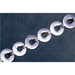 MEXICAN 970 GRADE SILVER BRACELET, formed as a series of connected circles, maker : Antonio Pined...