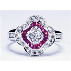 14K WHITE GOLD COCKTAIL RING, channel set with 16 French cut rubies (approx. 0.46ct. total weight...