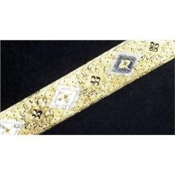 18K YELLOW AND WHITE GOLD BRACELET, with engraved decoration, 62.4 grams...