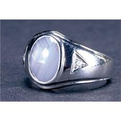 MEN'S 14K WHITE GOLD RING, bezel set with an oval star sapphire cabochon (12.3mm x 9.45mm x 6.15m...