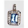 Image 1 : 14K YELLOW GOLD ENHANCER, set with a fancy rectangular cut blue topaz (approx. 9.40ct.) within a...