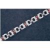 Image 1 : 14K YELLOW AND WHITE GOLD FILIGREE BRACELET, set with 22 French cut rubies (approx. 0.85ct. total...