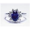 Image 1 : PLATINUM RING, set with an oval cut sapphire (approx. 1.20ct.) encircled by 10 brilliant cut diam...