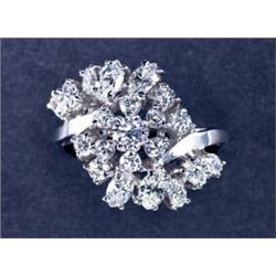 14K WHITE GOLD CLUSTER RING, set with a swirl of 10 marquis cut and 11 brilliant cut diamonds (ap...