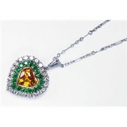 14K WHITE GOLD AND YELLOW GOLD PENDANT, bezel set with a heart cut yellow sapphire (approx. 1.75c...