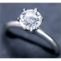 TIFFANY & CO. PLATINUM SOLITAIRE RING, set with a brilliant cut diamond (approx. 1.06ct.), with T...