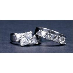 14K WHITE GOLD ENGAGEMENT AND WEDDING RING SUITE, set with a marquis cut diamond (approx. 1.27ct....