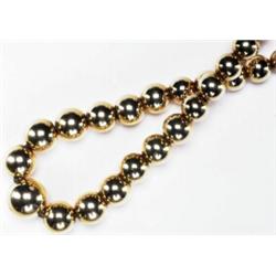 FRENCH 18K YELLOW GOLD NECKLACE, formed of a single graduated strand of gold beads, l. 15" - 38.1...