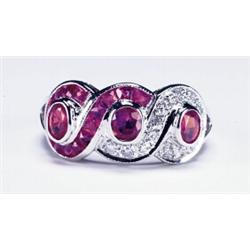 14K WHITE GOLD RING, set with 3 oval cut and 15 French cut rubies (approx. 1.71ct. total weight)...
