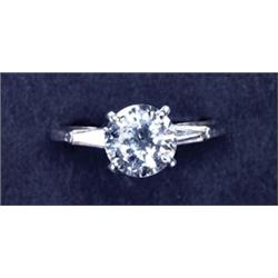PLATINUM SOLITAIRE RING, set with a brilliant cut diamond (approx. 2.30ct.) flanked by 2 small ta...
